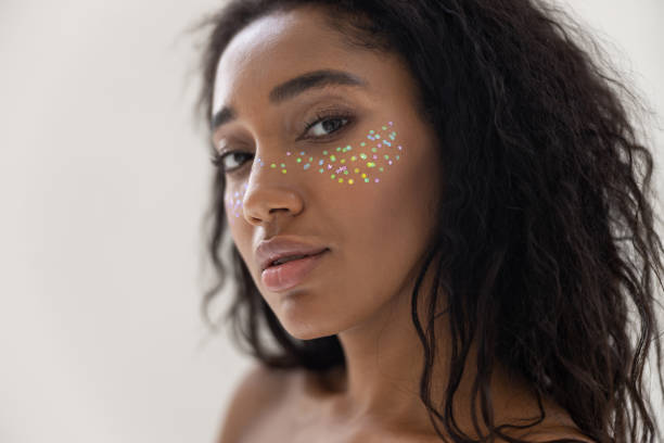 istock Calm woman with startling makeup posing for camera 1194724112