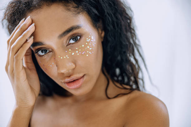 istock Charming girl with startling makeup posing for camera 1194724125