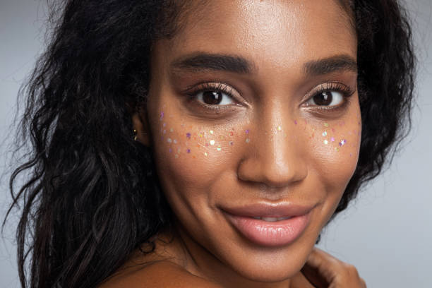 istock Smiling woman with startling makeup posing for camera 1194724126