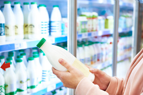Woman shopping milk stock photo