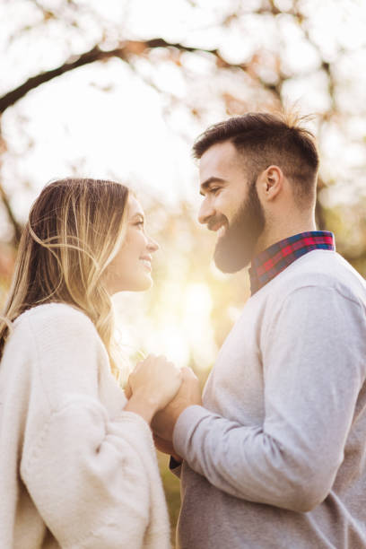 istock Young couple in love talking while enjoying in autumn day 1194728002