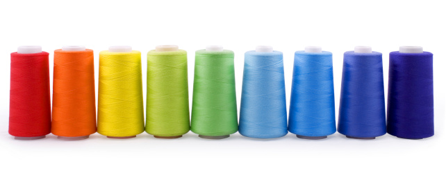 Yarn bobbins making in a textile factory.Textile Industry Concept image., wool, cotton, warping machine, thread, bobbin