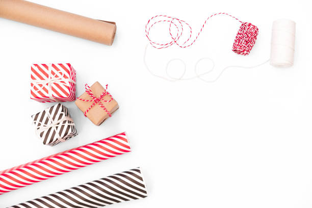 istock Flat lay with christmas present, wrapping paper, ribbon on white tabletop 1194728245