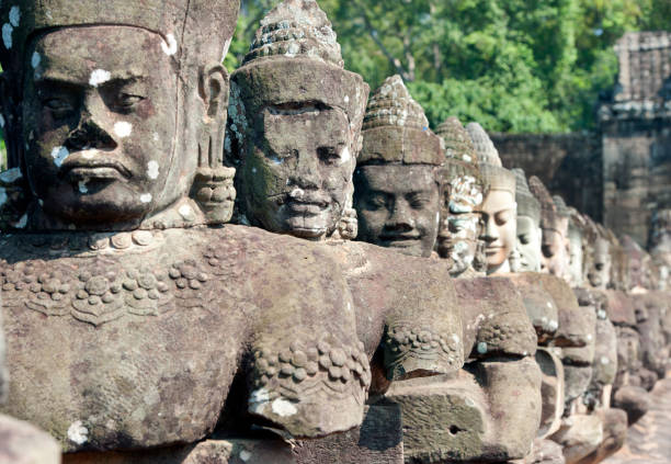 istock Ta Prohm Nats in a row on access bridge, Angkor Wat temple complex, Siem Reap, Cambodia 1194729131