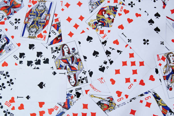 istock Scattered on the table a bunch of playing cards. Background composition. 1194729223
