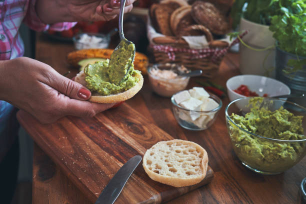 istock Preparing Avocado Sandwich with Tomato and Feta Cheese 1194729576