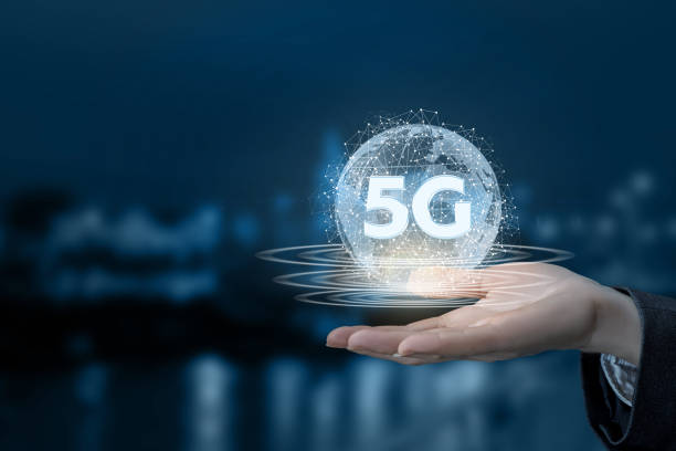 istock A hand is holding a digital sphere with 5G sign inside. 1194730719