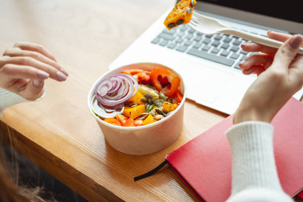 istock Close up of female hand that holding plastic fork 1194735989