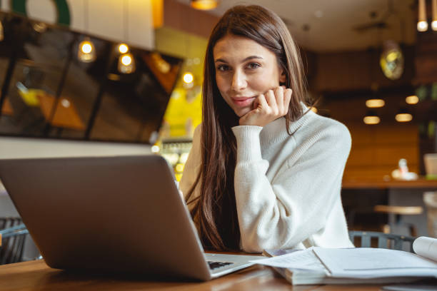 istock Relaxed young brunette looking straight at camera 1194736520