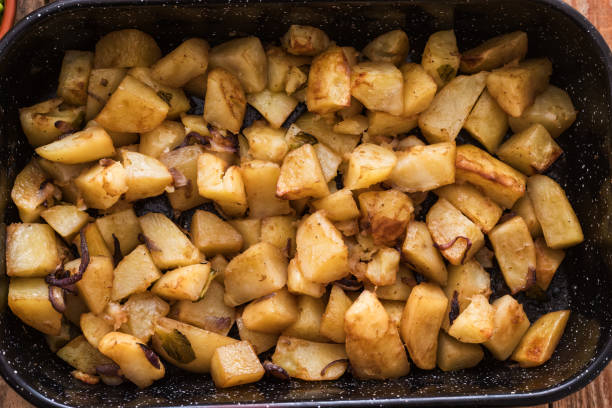 istock Fresh made Roasted potato cunks in metal casserole dish 1194738930