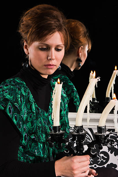 Woman with candlestick stock photo