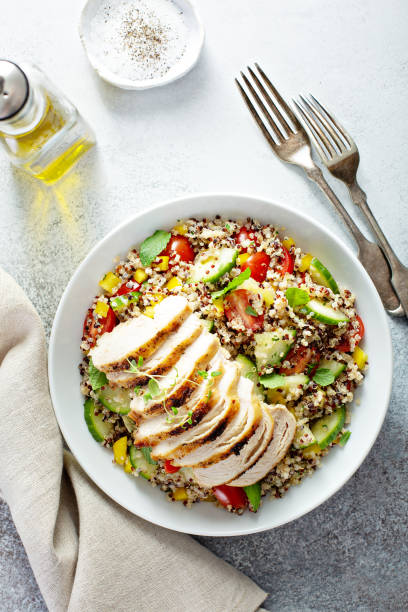 istock Fresh quinoa tabbouleh salad with grilled chicken 1194739816