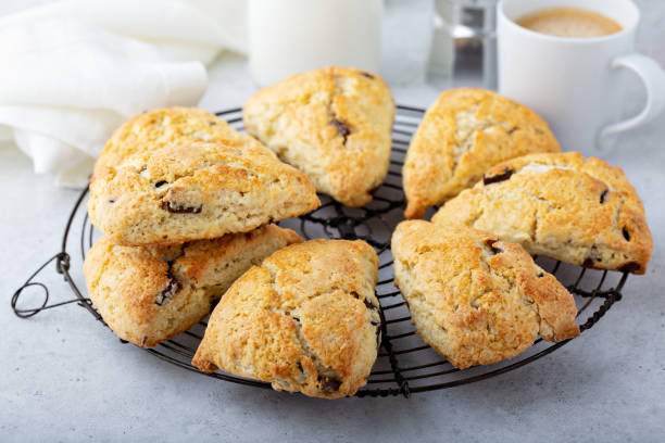 Homemade chocolate chip scones Homemade chocolate chunk scones with coffee for breakfast scone photos stock pictures, royalty-free photos & images