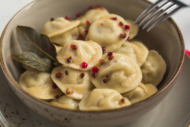 pelmeni Homemade pelmeni - russian dumplings with minced meat: pork and beef. russian pelmeni stock pictures, royalty-free photos & images