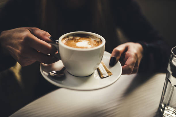istock Female hands holding cup of coffee 1194743987