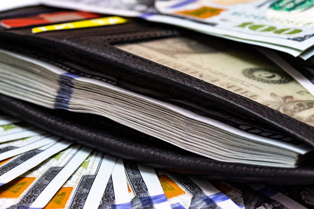 istock Purse filled with money macro close up 1194744916