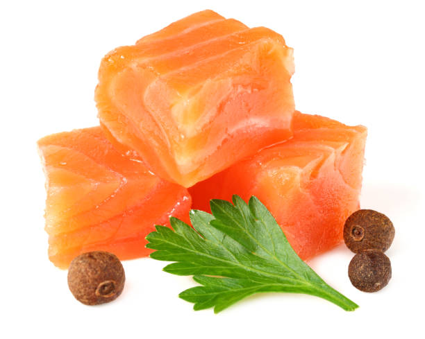 istock Red fish. Raw salmon fillet with parsley and peppercorns isolate on white background 1194745074