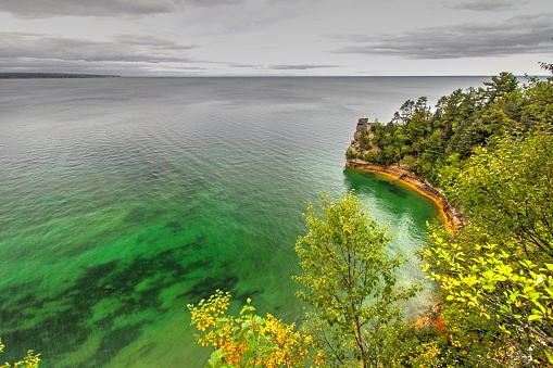 The natural landmark Miners Castle at the Pictured Rocks National Lakeshore is a seastack that towers above the blue waters of Lake Superior in the Upper Peninsula of Michigan.