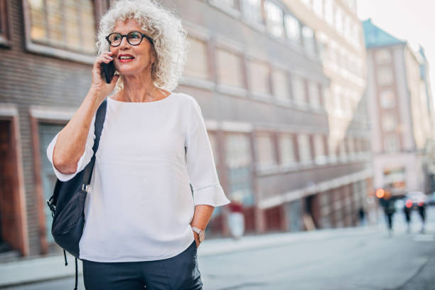 istock Senior woman using phone 1194748124