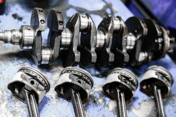 istock crankshaft and pistons with connecting rods on the table 1194748150