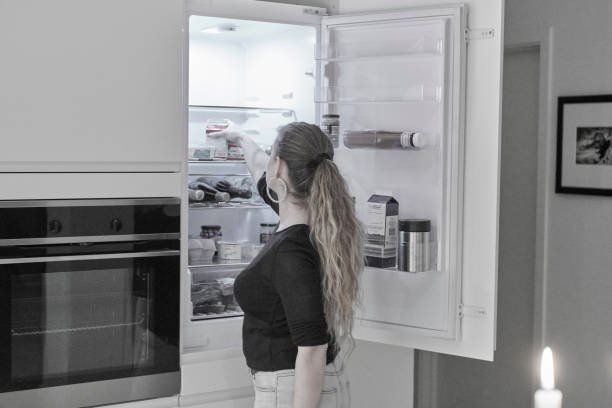 istock House wife checking the fridge 1194748284