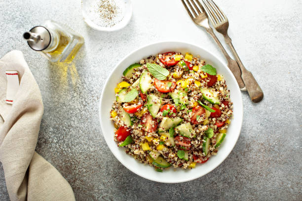 Fresh quinoa tabbouleh salad Fresh quinoa tabbouleh salad with tomatoes and cucumbers quinoa photos stock pictures, royalty-free photos & images