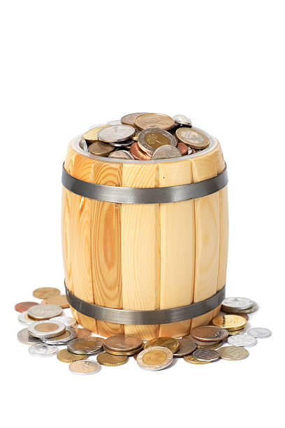 istock overflowing barrel with various coins 119475296