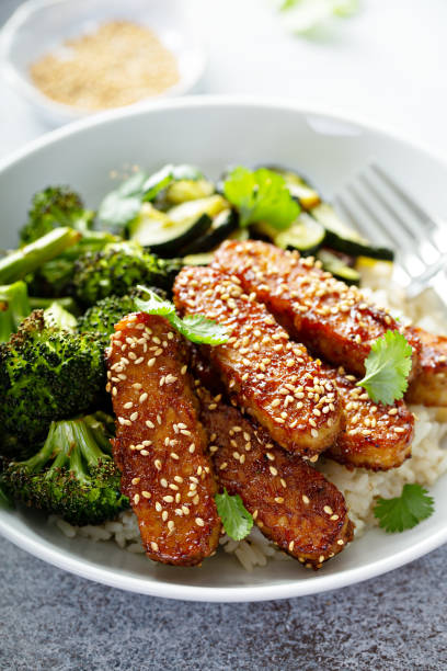 istock Teryaki tempeh with rice and vegetables 1194753868