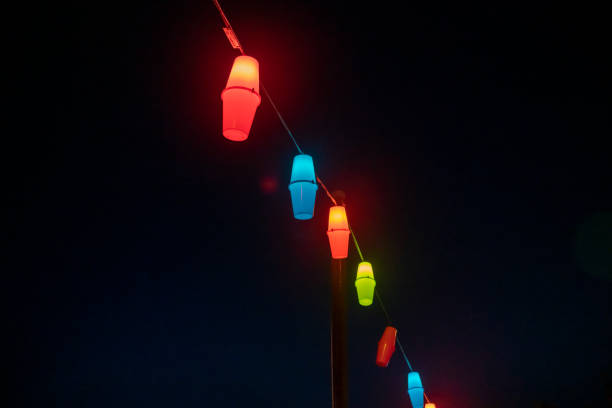 String of Christmas lights hanging on a street