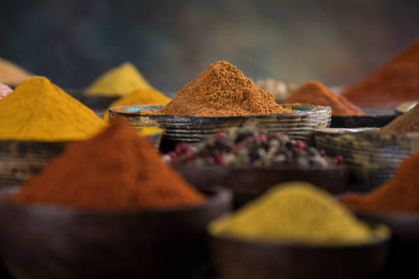 istock Colorful spices in bowl background 1194755898