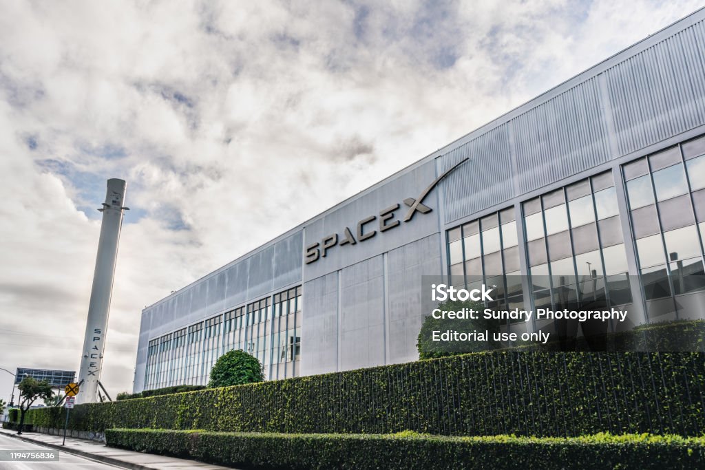 SpaceX headquarters Dec 8, 2019 Hawthorne / Los Angeles / CA / USA - SpaceX (Space Exploration Technologies Corp.) headquarters; Falcon 9 rocket displayed on the left; SpaceX is a private American aerospace manufacturer SpaceX Stock Photo