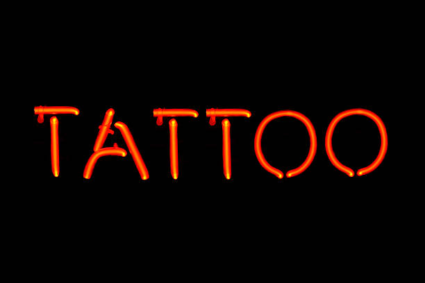 istock Red neon tattoo parlor sign on black background 119475810