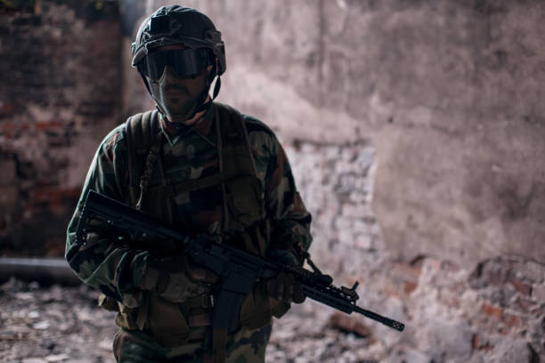 istock Soldier with full equipment in war zone 1194760110