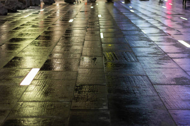 istock wet pavement with floor lighting.the reflection of the background texture 1194760188
