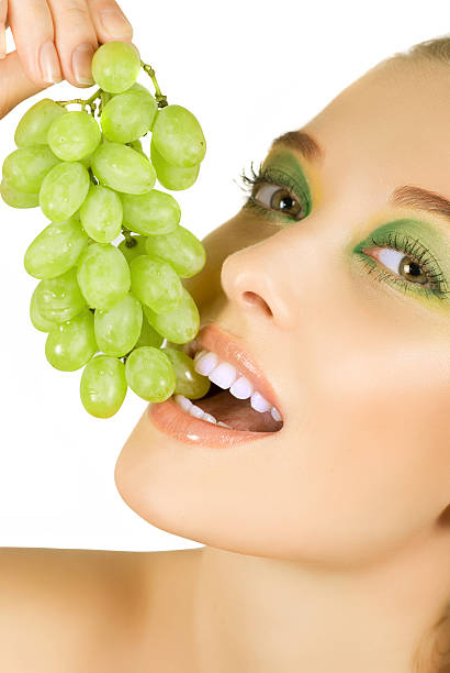 istock girl with grapes 119476316