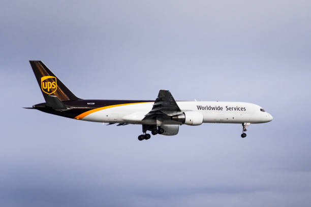 UPS Airlines aircraft preparing for landing Dec 11, 2019 San Jose / CA / USA - UPS Airlines aircraft approaching San Jose International Airport; UPS Airlines is an American cargo airline, subsidiary of  UPS (United Parcel Service) landing touching down stock pictures, royalty-free photos & images