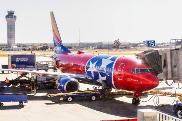 Tennessee One Southwest Airlines aircraft docked at Austin-Bergstrom International Airport (AUS) Dec 14, 2019 Austin / TX / USA - Tennessee One Southwest Airlines aircraft (livery honoring and modeled after the Tennessee state flag) docked at Austin-Bergstrom International Airport (AUS); austin airport stock pictures, royalty-free photos & images