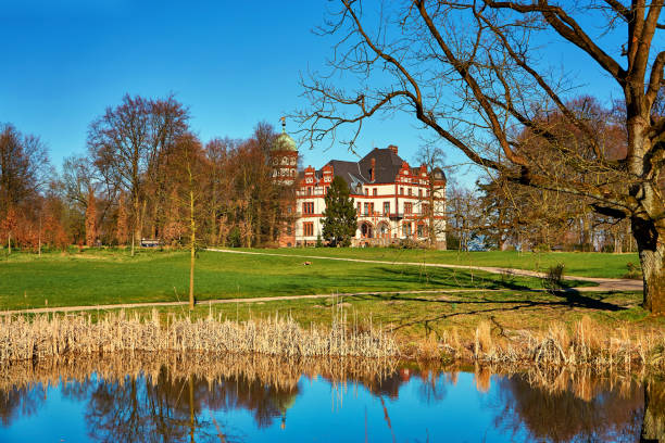 Wiligrad, Germany - March 31, 2019: Wiligrad Castle with castle pond. Mecklenburg-Vorpommern, Germany