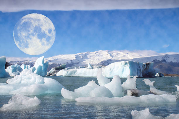 moon over ice in the arctic stock photo