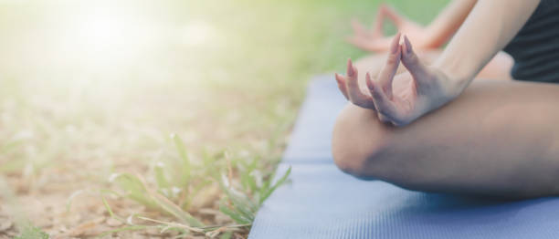 istock closeup of hands doing yoga lotus posing 1194781143