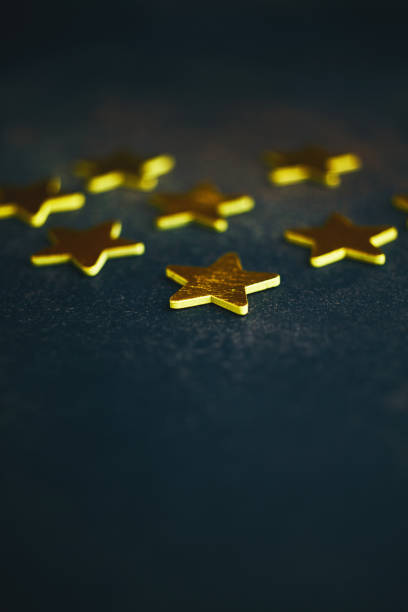 istock Background with shiny gold stars 1194783298