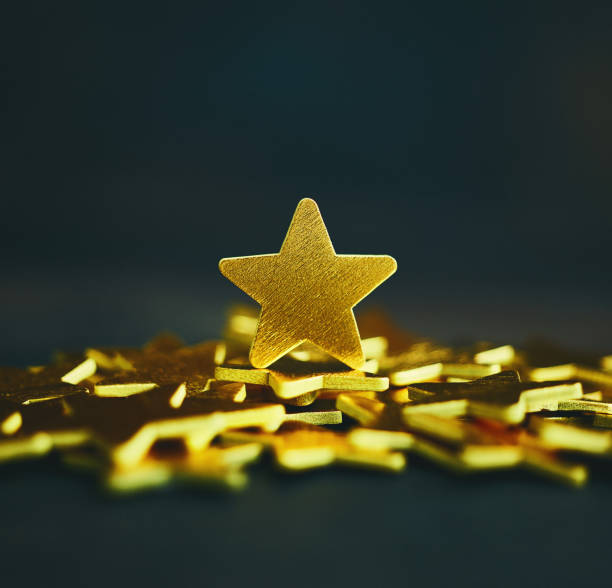 istock Background with shiny gold stars 1194783332