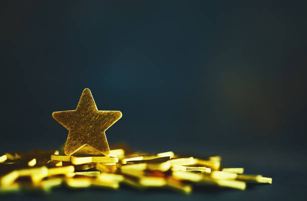 istock Background with shiny gold stars 1194783344
