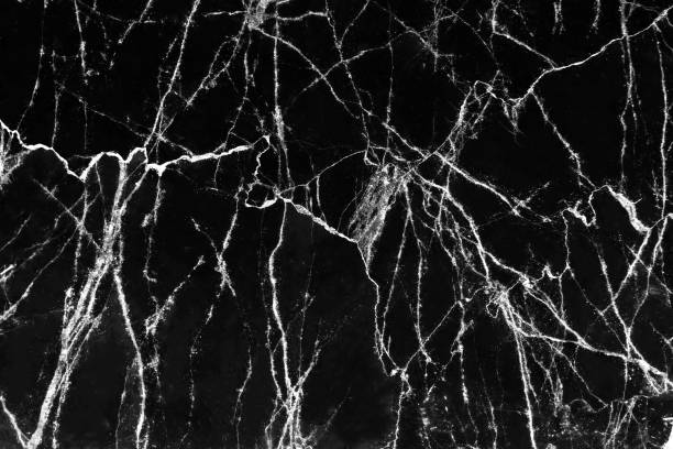 istock Marble black surface white cracked veins patterns abstract nature background 1194787787