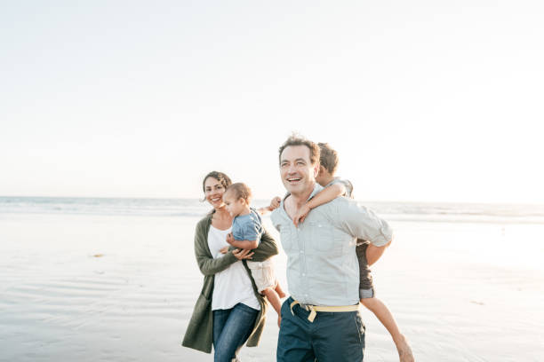 istock FAmily having fun on the beach together 1194787989