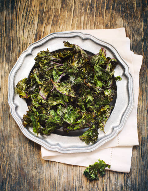 istock Kale chips with sea salt on baking tray 1194793651