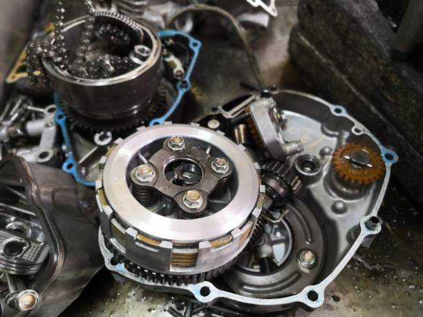istock Part of motorcycle engine in stainless steel tray in workshop.Automatic system. 1194795352