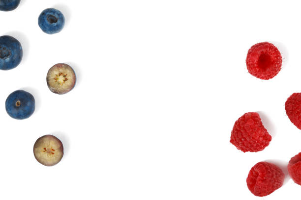 Fresh blueberries and raspberries on white background, top view