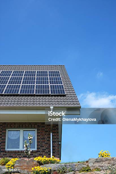 Solar Panels On Top Of A Brick House Roof Stock Photo - Download Image Now - Solar Panel, Solar Energy, House