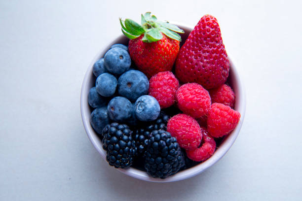 istock strawberries, blueberries, blackberries and raspberries 1194798807
